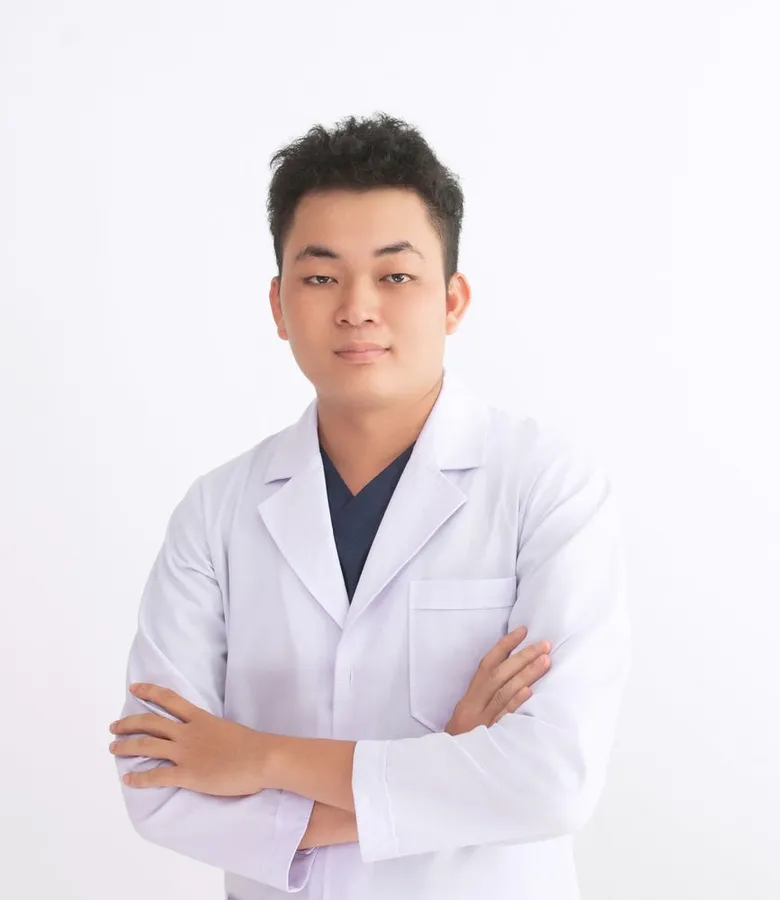 Dr. Jason Lim, cosmetic dentist, in a white coat