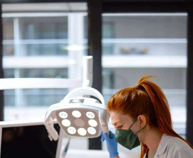 A dentist talking a patient through their treatment plan in the clinic